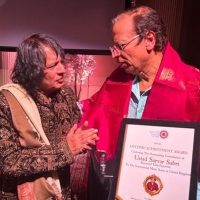 Legendary Tabla Maestro Ustad Tari Khansahb And Sahana Gero MBE Artistic Director Of World Heart Beat Music Academy, London Presented The Award To Ustad Sarvar Sabri
